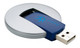 A circular USB flash drive with a flip mechanism, featuring a silver exterior and a blue connector, along with a logo.