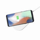 A wireless charger in white with a smartphone on top, displaying a low battery indicator.