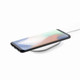 A wireless charger with a sleek black design, featuring a smartphone resting on it.