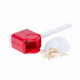 A red and white sharpening tool with shavings spilling out, designed for pencils. It has a logo on the side.