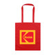A red tote bag featuring a large yellow square with a logo, including a prominent 'K' design.