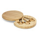A round bamboo cheese board with a removable section containing cheese knives.