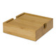 A bamboo coaster with a natural finish, featuring a groove on one side and a smooth surface.