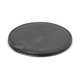 A round, black wireless charger with a smooth surface and a micro USB port.