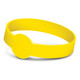 A yellow silicone wristband with a debossed design, featuring a circular emblem at the centre.