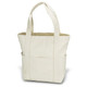 A beige canvas tote bag with two sturdy handles and an exterior pocket. It has a simple design and is unadorned.