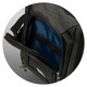 A cooler bag in dark grey featuring a zippered compartment and a blue insulated interior. It has a logo.