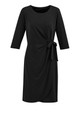 A black women's dress with a tie detail at the waist and three-quarter sleeves. It features a wrap style design.