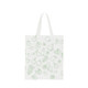 A white cotton tote bag featuring a green fruit pattern and short handles, with a logo on the side.