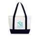 A large canvas tote bag in white with navy blue handles and base, featuring a logo on the front.