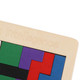 A wooden puzzle featuring multicoloured blocks in green, purple, red, and blue, with a logo present.