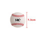 A training baseball in white with red stitching, featuring a logo on its surface, measuring 7.3 cm in diameter.
