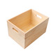 A large wooden storage box in a natural finish, featuring cut-out handles for easy carrying.