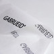 A sheet of white Kraft paper featuring a repeating black logo in an elegant font.