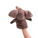 A grey plush elephant hand puppet with large ears and a soft texture, held up by a hand.