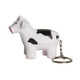 A cow-shaped stress reliever in white and black, attached to a keyring. It features a simple design and a metallic keychain.