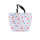 A polyester cooler tote bag featuring a nautical design with red, blue, and white elements. It has black handles and a logo.