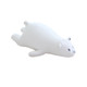 A white bear-shaped travel pillow with small ears and a simple face design, featuring a soft, plush surface.