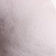 A soft, grey U-shaped travel pillow with a textured fabric, featuring a subtle pattern and a logo.