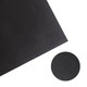A black diatomite floor mat featuring a textured surface and a circular inset showing the material's pattern.