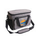 A grey cooler bag with a removable shoulder strap, featuring a front zip pocket and a logo.