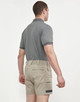 Unisex cotton stretch drill short work shorts in beige, paired with a grey polo shirt, shown from the back.