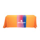 A medium table runner in orange with a central design featuring a gradient of blue and pink, displaying a logo.