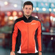 A men's sports jacket in red and black, featuring a logo and a sleek, modern design.