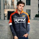 A man wears a custom men's premium softshell jacket in grey, orange, and white, featuring a brand logo.