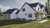 Farmhouse House Plan - Harmdierks 18764 - Left Exterior