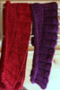 Roll & Ruffle- We made two versions using the same pattern, but worked at different gauges. We couldn’t decide which we preferred! The purple scarf was knit on size US 11 needles, getting a gauge of 3 sts an inch resulting in more defined ruffles and roll. Free pattern available for download.