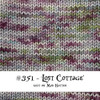 This knit swatch of "Lost Cottage" shows off the light gray base that is layered with splashes of mulberry, spring green, and a soft blue.