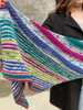 The fun striped Sussurro Shawl by Wonderland Yarns uses a calm tonal contrasted with three vibrant colors to create a chatty shawl that can be thrown on and tied on the way out the door. These new kits make pairing colors a breeze!