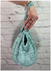 Knit this darling dumpling bag with one skein of Mad Hatter