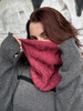 This cozy cowl features all-over cables and a playful twist—dangling cables sneaking into the ribbing. Worked with simple stitches it’s an eye-catching knit that’s more intuitive than it looks.