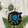 Poppy circle notion bags are available in three colors. Black (shown here), gray, and white.