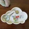 Well Sorted cloud-shaped knitting notions tray holding stitch markers and small project accessories.
