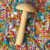 Equal parts practical and charming, this whimsical mushroom darner is a handy companion for mending socks, repairing knitwear, and reinforcing well-loved garments.