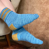 Indulge in cozy comfort with a pair of Twice As Rice socks that incorporate a rice-textured heel and striped cuff in a coordinating pop of color, adding an unexpected element to your everyday attire.