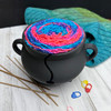 A little cauldron with a very practical purpose. Compact enough for a side table, desk, or wherever you tend to settle in and stitch!