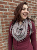 The elongated triangular shape makes the shawl especially versatile, allowing it to wrap easily and sit comfortably on the shoulders.