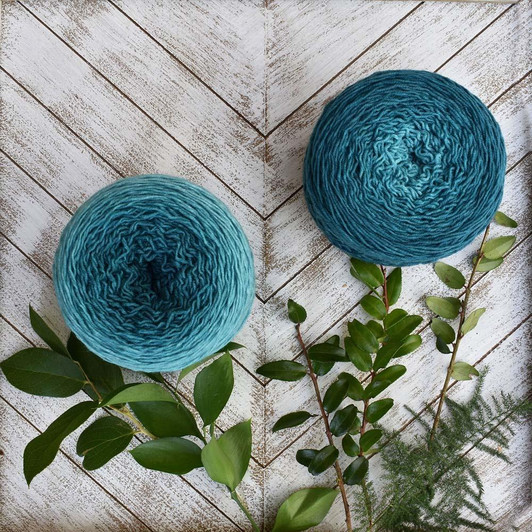 Jade Mar-Flower is a Blossom gradient cake that starts as a dark turquoise and morphs into a light seaglass teal. Hand-dyed by Wonderland Yarns on Mad Hatter sport or sock/fingering weight yarn. Made in Vermont.
