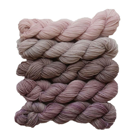 Quantity of Poetry is a collection of five variegated mini-skeins in dusty, muted, pinks and brown shades.