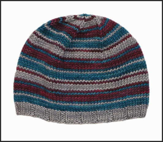 A quick knit, this grab-and-go hat kit stripes 3 colors of Wonderland Yarns hand-dyed worsted mini skeins.