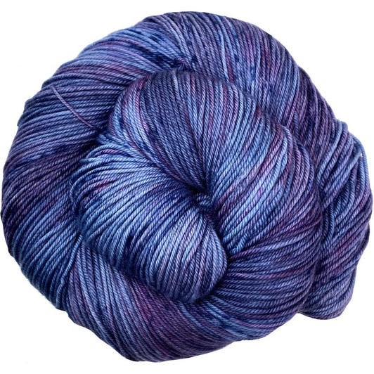 "Moody Moors" is a deep purple-blue, layered with orchid and speckled with midnight blue from the Off the Path collection by Wonderland Yarns. Available to order on any base. Dyed to order.