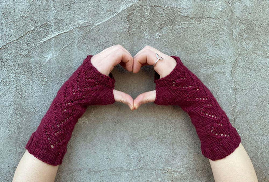 Love Struck Mitts-Put your heart on your sleeve… er, wrists… with these adorable fingerless mitts. Perfect to knit up for gifts or just to keep warm in the office! This pattern was featured in our 2020 De-Stitch-Nation Yarn Club.