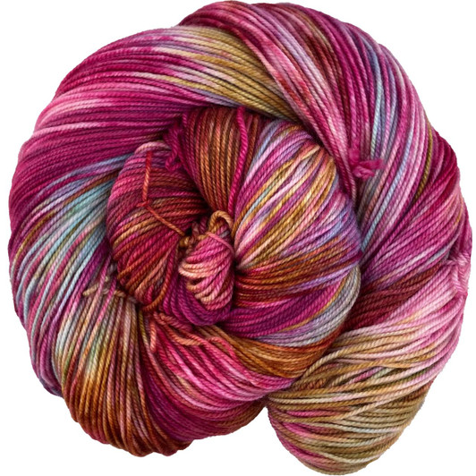 A punchy, vibrant pink variegated with splashes of sky blue and copper-brown from our Magical Menagerie collection. This colorway is available on a variety of yarn bases. Hand-dyed in the USA.