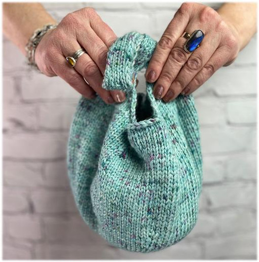 Knit this darling dumpling bag with one skein of Mad Hatter