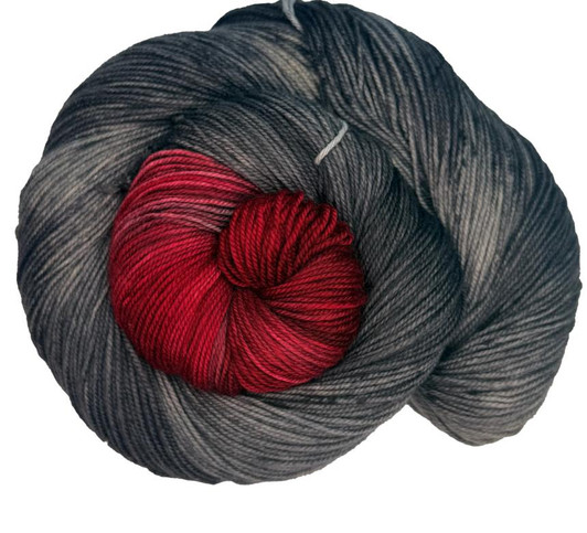 A Spark in the Ashes is black and grey base with highs and lows, featuring a bright red burst, hand-dyed in Brattleboro, VT. A Spark in the Ashes is black and grey base with highs and lows, featuring a bright red burst, hand-dyed in Brattleboro, VT.