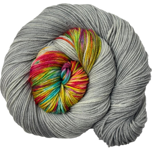 A colorburst with a light grey base and a rainbow variegated burst. Hand-dyed in Brattleboro, VT